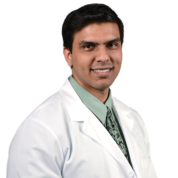 profile picture of Dr. Khurana wearing a green shirt and tie with a white lab coat.