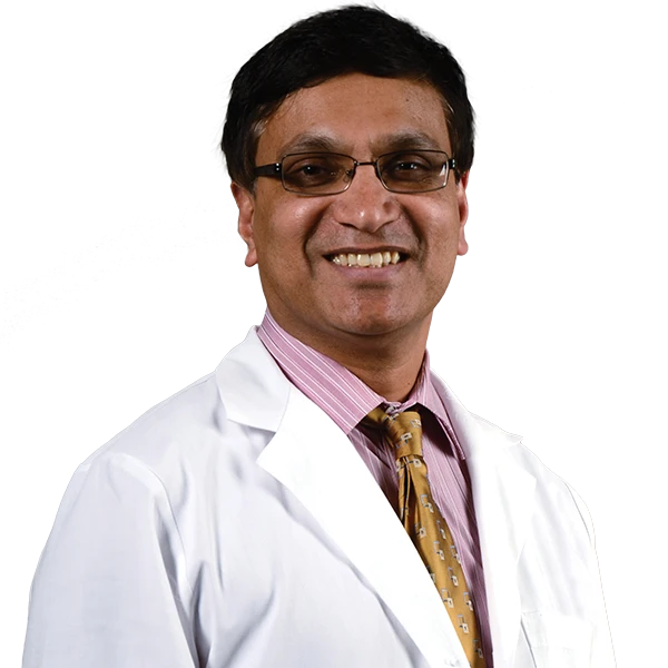 profile picture of Dr. Muthalaly in a pick shirt, yellow tie and white lab coat.