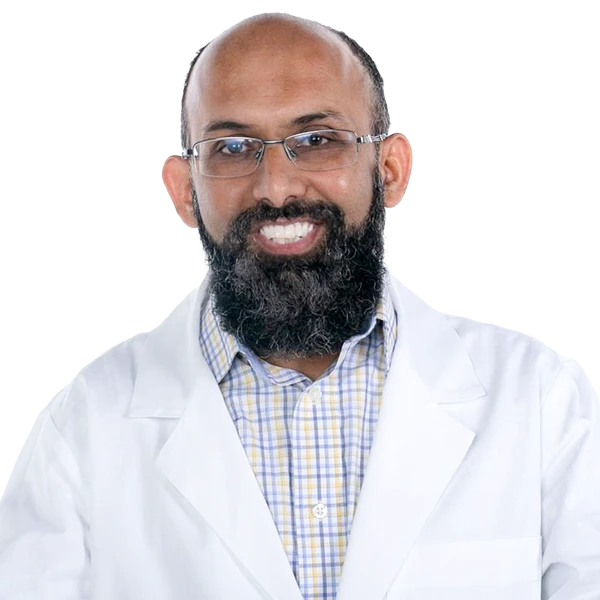 portrait of Dr Salah Uddin wearing a blue and yellow striped shirt and white jacket.