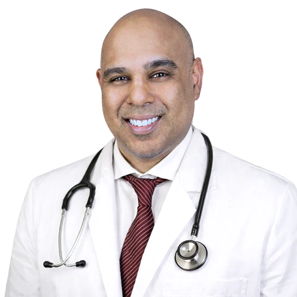 portrait of Dr Sunil Agrawal wearing a red tie, white shirt and white jacket.