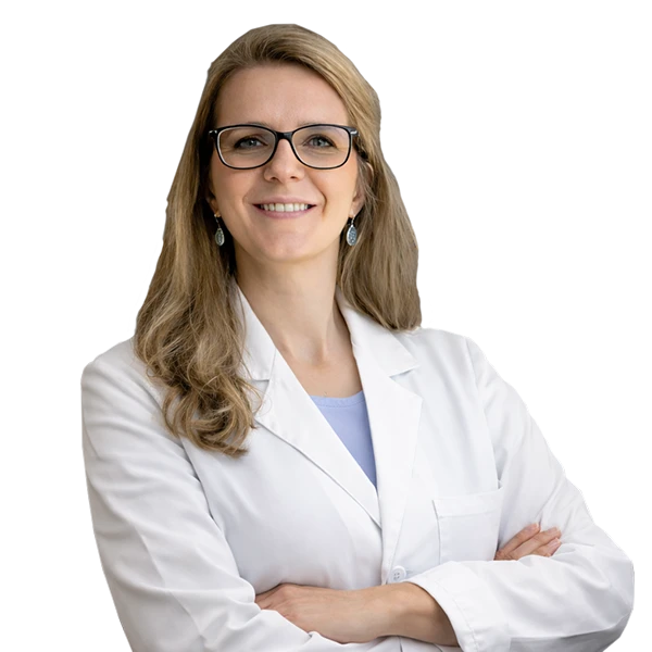 Portrait of Heidi Tingey wearing a white lab coat and light blue shirt.